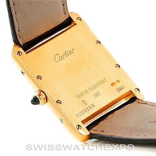 The image displays the backside of a Cartier Tank Louis W1529756 Men's Yellow Gold Silver Dial W1529756 Men's Yellow Gold Silver Dial watch, highlighting the case back, crown, and part of the leather strap.