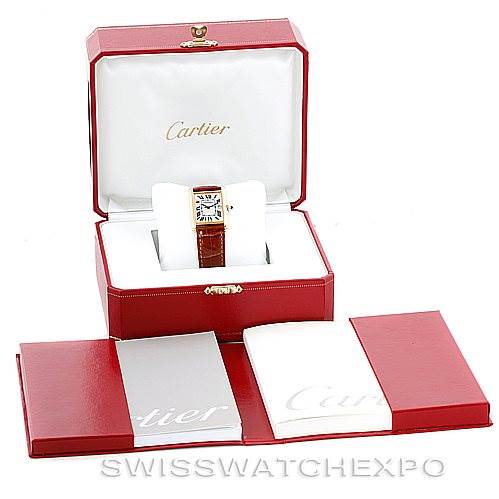 The image shows a Cartier Tank Louis W1529756 Men's Yellow Gold Silver Dial W1529756 Men's Yellow Gold Silver Dial watch in its open red box, with additional booklets and packaging displayed in the foreground.