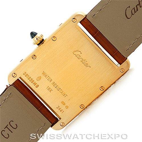 This image shows the back case and leather straps of a Cartier Tank Louis W1529756 Men's Yellow Gold Silver Dial W1529756 Men's Yellow Gold Silver Dial model watch from a top-down angle.