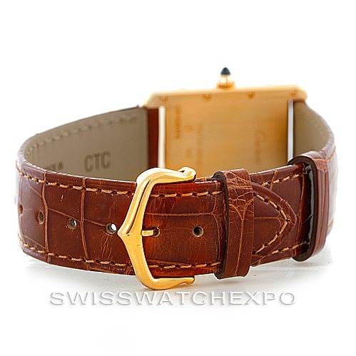 The image shows the back view of the Cartier Tank Louis W1529756 Men's Yellow Gold Silver Dial W1529756 Men's Yellow Gold Silver Dial watch, highlighting its brown leather strap and gold buckle.