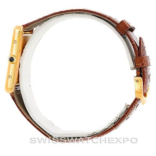 This image shows a side view of the Cartier Tank Louis W1529756 Men's Yellow Gold Silver Dial W1529756 Men's Yellow Gold Silver Dial model watch, highlighting the case, crown, and brown leather strap.