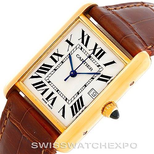 The image shows a Cartier Tank Louis W1529756 Men's Yellow Gold Silver Dial W1529756 Men's Yellow Gold Silver Dial watch at an oblique angle, featuring its dial, blue hands, Roman numerals, and brown leather strap.