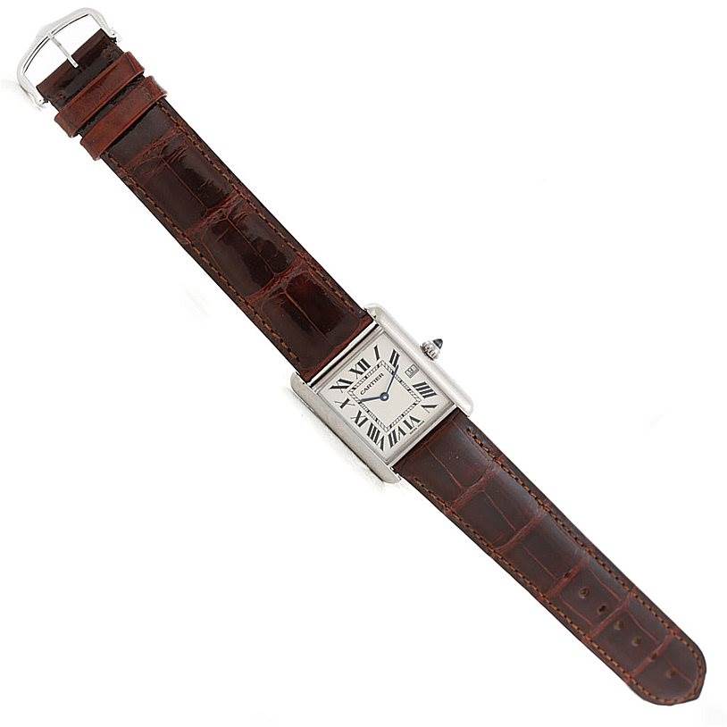 This image shows a Tank Louis model by Cartier from a top-down angle, displaying the entire watch, including the dial and leather strap.