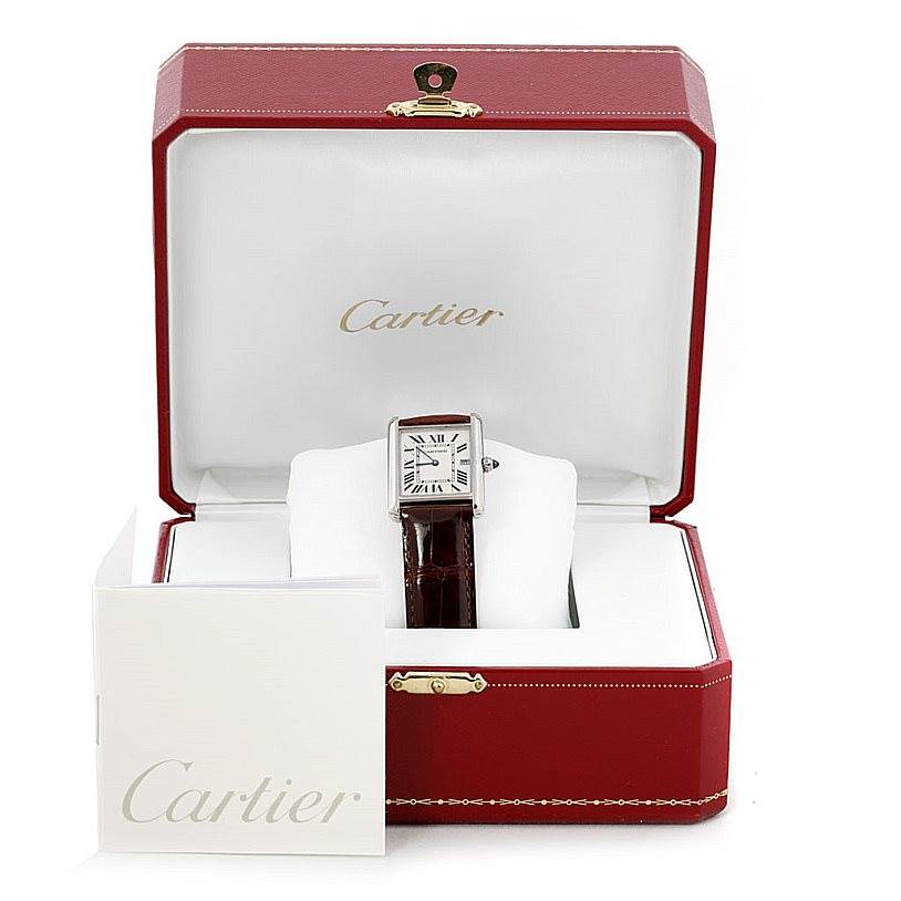 The Cartier Tank Louis W1540956 Men's White Gold White Dial W1540956 Men's White Gold White Dial watch is displayed front-on in an open red box, accompanied by a Cartier booklet.