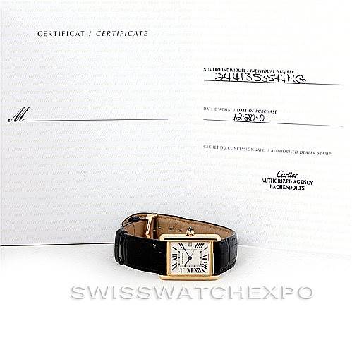The image displays a Cartier Tank Louis W1529756 Men's Yellow Gold Silver Dial W1529756 Men's Yellow Gold Silver Dial watch lying flat with its certificate in the background.
