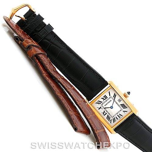 The image shows a Cartier Tank Louis W1529756 Men's Yellow Gold Silver Dial W1529756 Men's Yellow Gold Silver Dial watch with a gold case and a black leather strap, alongside an additional brown leather strap.