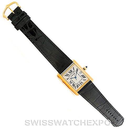 The image shows a top view of a Cartier Tank Louis W1529756 Men's Yellow Gold Silver Dial W1529756 Men's Yellow Gold Silver Dial watch, featuring a gold rectangular case and a black leather strap.