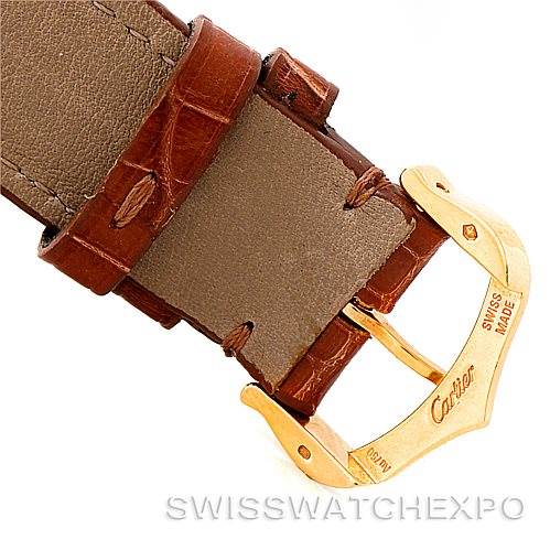 The image shows the gold buckle and brown leather strap of a Cartier Tank Louis W1529756 Men's Yellow Gold Silver Dial W1529756 Men's Yellow Gold Silver Dial watch, with the engraving "Swiss Made."
