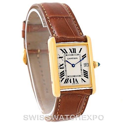 The image shows a Cartier Tank Louis W1529756 Men's Yellow Gold Silver Dial W1529756 Men's Yellow Gold Silver Dial watch angled to display the face, brown leather strap, and part of the crown.