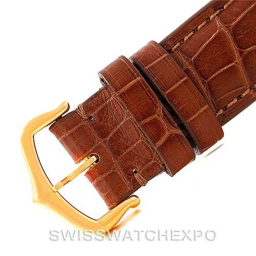 This image shows a close-up of the brown leather strap and gold buckle of the Cartier Tank Louis W1529756 Men's Yellow Gold Silver Dial W1529756 Men's Yellow Gold Silver Dial watch.