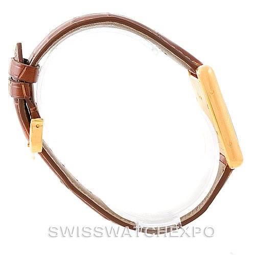 This image shows a side view of the Cartier Tank Louis W1529756 Men's Yellow Gold Silver Dial W1529756 Men's Yellow Gold Silver Dial model, highlighting its brown leather strap and gold case.