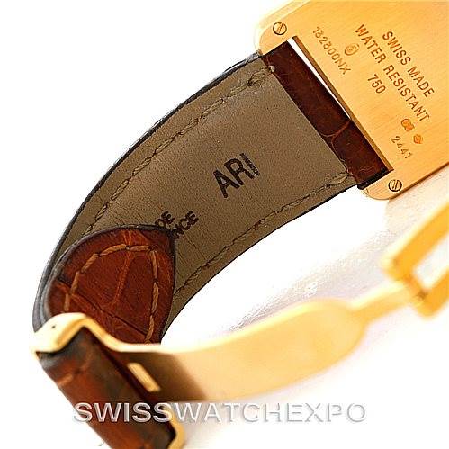 This image shows the inside of the leather strap and part of the buckle of a Tank Louis model by Cartier, displaying markings and the buckle.