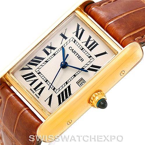 The image shows a close-up view of the Cartier Tank Louis W1529756 Men's Yellow Gold Silver Dial W1529756 Men's Yellow Gold Silver Dial watch face, bezel, and part of the leather strap, highlighting the blue hands and Roman numerals.