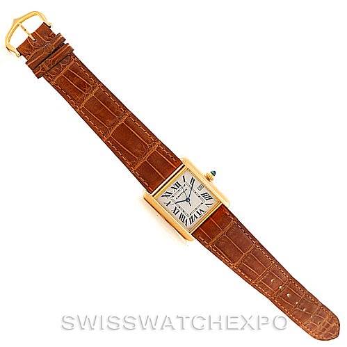 The image shows a top view of the Cartier Tank Louis W1529756 Men's Yellow Gold Silver Dial W1529756 Men's Yellow Gold Silver Dial watch with a brown leather strap and a rectangular gold case.