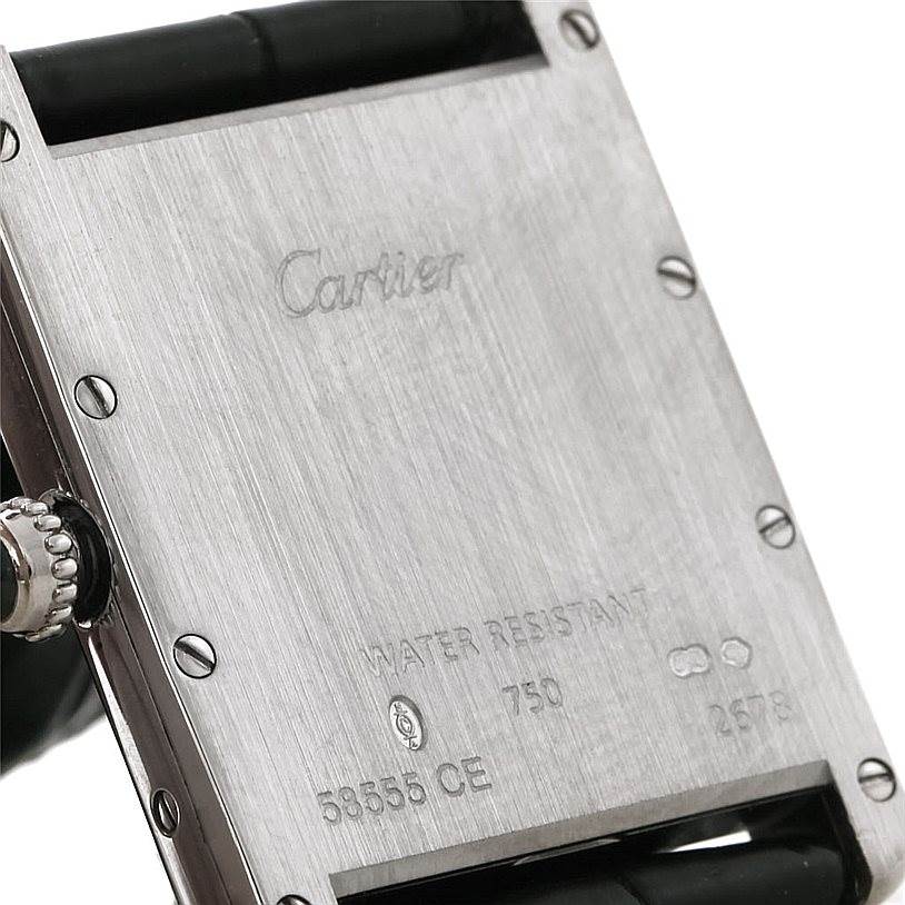 This image shows the back casing of a Cartier Tank Louis W1540956 Men's White Gold White Dial W1540956 Men's White Gold White Dial watch, highlighting its engravings and screws.