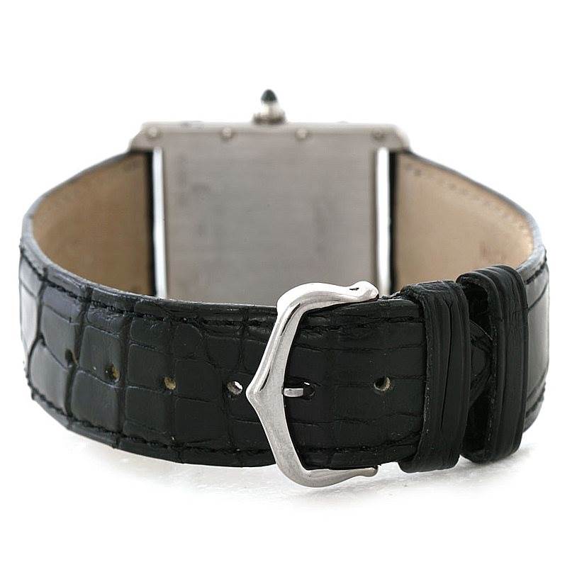 The image shows a rear view of the Tank Louis model by Cartier, focusing on the strap and buckle.