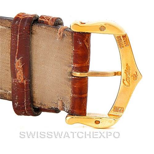 Close-up of the clasp and leather strap of the Cartier Tank Louis W1529756 Men's Yellow Gold Silver Dial W1529756 Men's Yellow Gold Silver Dial watch, showing brand engravings and stitch details.
