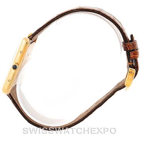 The image shows a side view of a Cartier Tank Louis W1529756 Men's Yellow Gold Silver Dial W1529756 Men's Yellow Gold Silver Dial watch, featuring its case, crown, and leather strap.