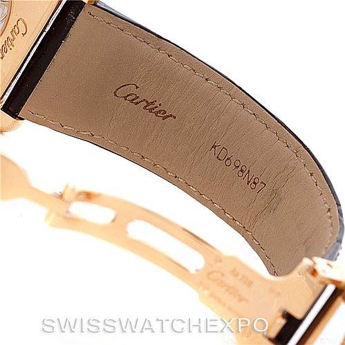 The image shows a close-up of the inner leather strap and gold clasp of a Cartier Tank Louis W1560003 Men
s Rose Gold Silver Dial W1560003 Men
s Rose Gold Silver Dial watch, displaying the brand
s logo and serial number.