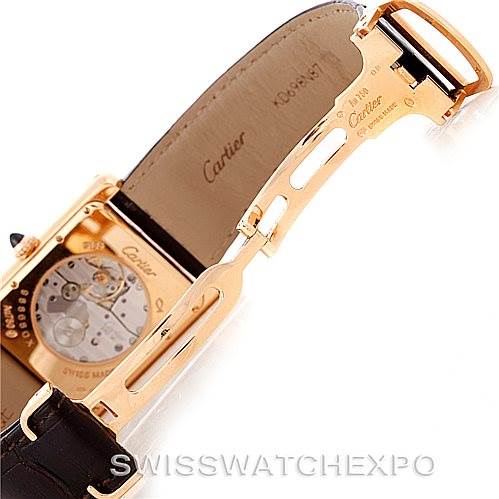 The image shows the back of a Tank Louis model by Cartier, focusing on the open clasp and inner mechanism.