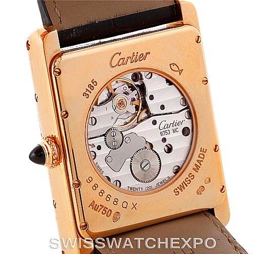 This image shows the back view of a Cartier Tank Louis W1560003 Men
s Rose Gold Silver Dial W1560003 Men
s Rose Gold Silver Dial watch, displaying its mechanical movement and inscriptions.