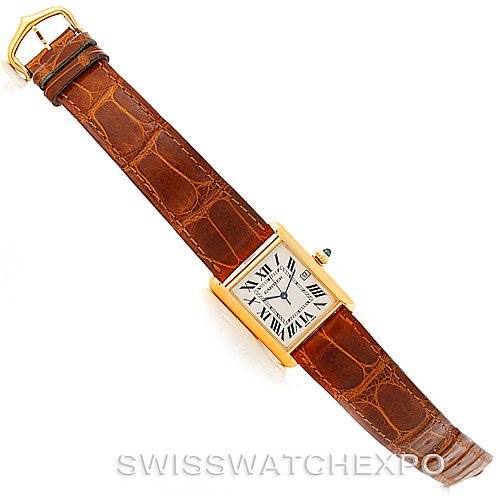 The image shows the Cartier Tank Louis W1529756 Men's Yellow Gold Silver Dial W1529756 Men's Yellow Gold Silver Dial model watch from a top-down angle, displaying the watch face and brown leather strap.