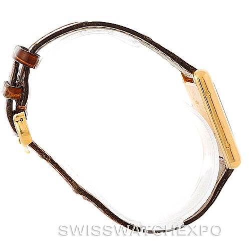 The image shows a side view of the Cartier Tank Louis W1529756 Men's Yellow Gold Silver Dial W1529756 Men's Yellow Gold Silver Dial model watch, highlighting the strap and gold case.