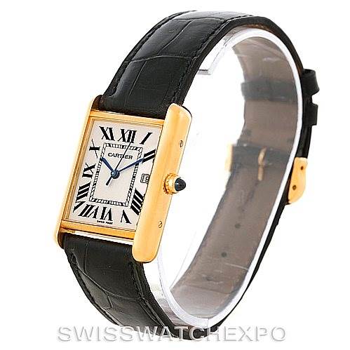 The image shows a side angle of the Tank Louis watch by Cartier with its black leather strap and gold case.