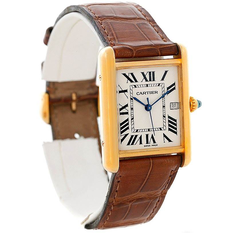 The image shows a Cartier Tank Louis W1529756 Men's Yellow Gold Silver Dial W1529756 Men's Yellow Gold Silver Dial model watch from an angled view, highlighting its rectangular face, Roman numerals, and leather strap.