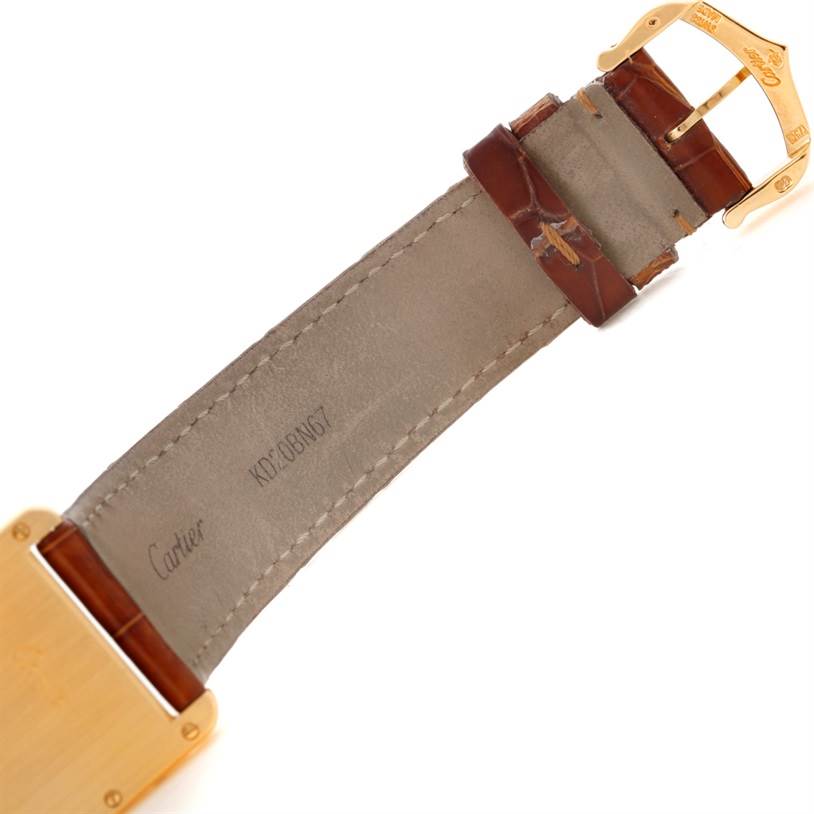 This image shows the inner side of the watch strap and buckle of a Cartier Tank Louis W1529756 Men's Yellow Gold Silver Dial W1529756 Men's Yellow Gold Silver Dial model watch.