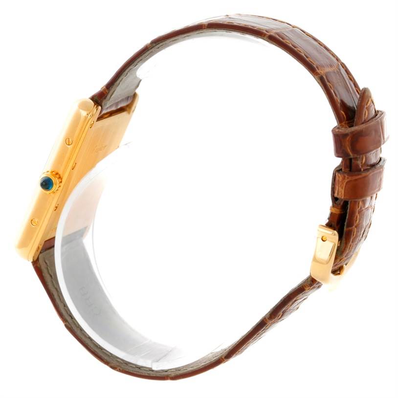 This image shows a side profile of the Cartier Tank Louis W1529756 Men's Yellow Gold Silver Dial W1529756 Men's Yellow Gold Silver Dial watch, highlighting the crown, case, and leather strap.