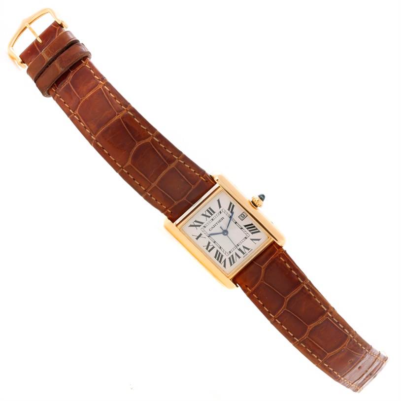 The image shows a Cartier Tank Louis W1529756 Men's Yellow Gold Silver Dial W1529756 Men's Yellow Gold Silver Dial watch from a top-down angle, highlighting its leather strap and rectangular face.