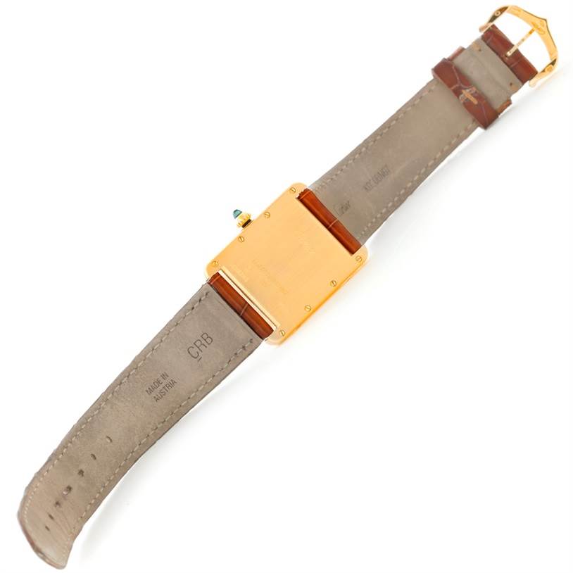 The image shows the back view of the Cartier Tank Louis W1529756 Men's Yellow Gold Silver Dial W1529756 Men's Yellow Gold Silver Dial watch, highlighting the case back and leather strap.