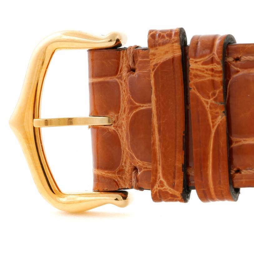 This image shows a close-up of the buckle and strap of a Tank Louis model by Cartier.