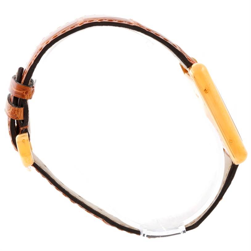 The Cartier Tank Louis W1529756 Men's Yellow Gold Silver Dial W1529756 Men's Yellow Gold Silver Dial watch is shown from a side profile, displaying the strap and the thickness of the case.