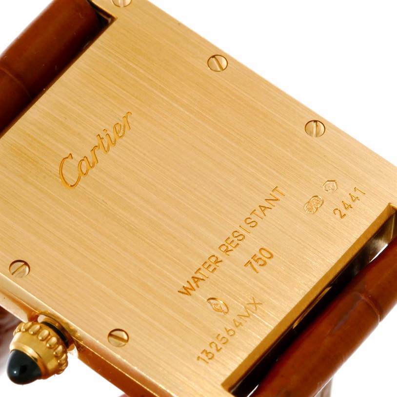 The image shows the back case and a section of the strap of a Cartier Tank Louis W1529756 Men's Yellow Gold Silver Dial W1529756 Men's Yellow Gold Silver Dial watch.