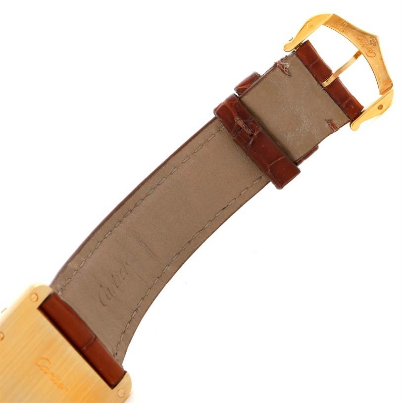 The image shows the strap and buckle of the Tank Louis watch by Cartier, viewed from the rear side.