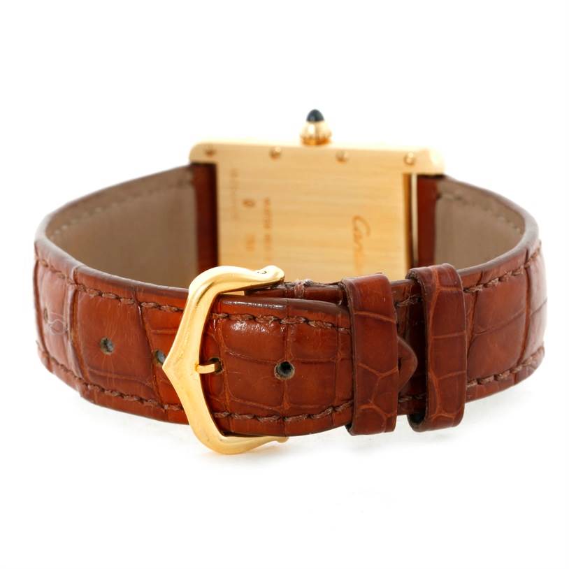 The image shows the back view of the Cartier Tank Louis W1529756 Men's Yellow Gold Silver Dial W1529756 Men's Yellow Gold Silver Dial watch, highlighting the brown leather strap and the gold buckle.