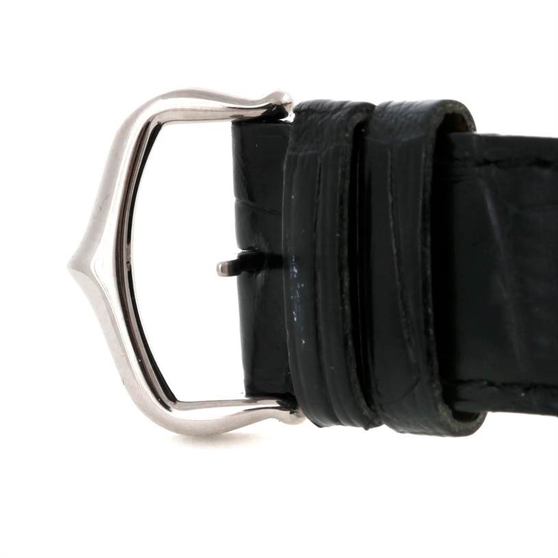 The image shows a close-up of the black leather strap and buckle of the Cartier Tank Louis W1540956 Men's White Gold White Dial W1540956 Men's White Gold White Dial watch.