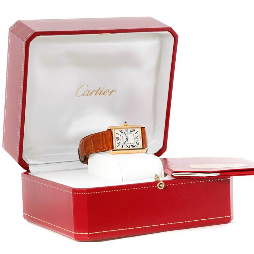 The Cartier Tank Louis W1529756 Men's Yellow Gold Silver Dial W1529756 Men's Yellow Gold Silver Dial watch is displayed inside its red box with the lid open, showing the face and leather strap.