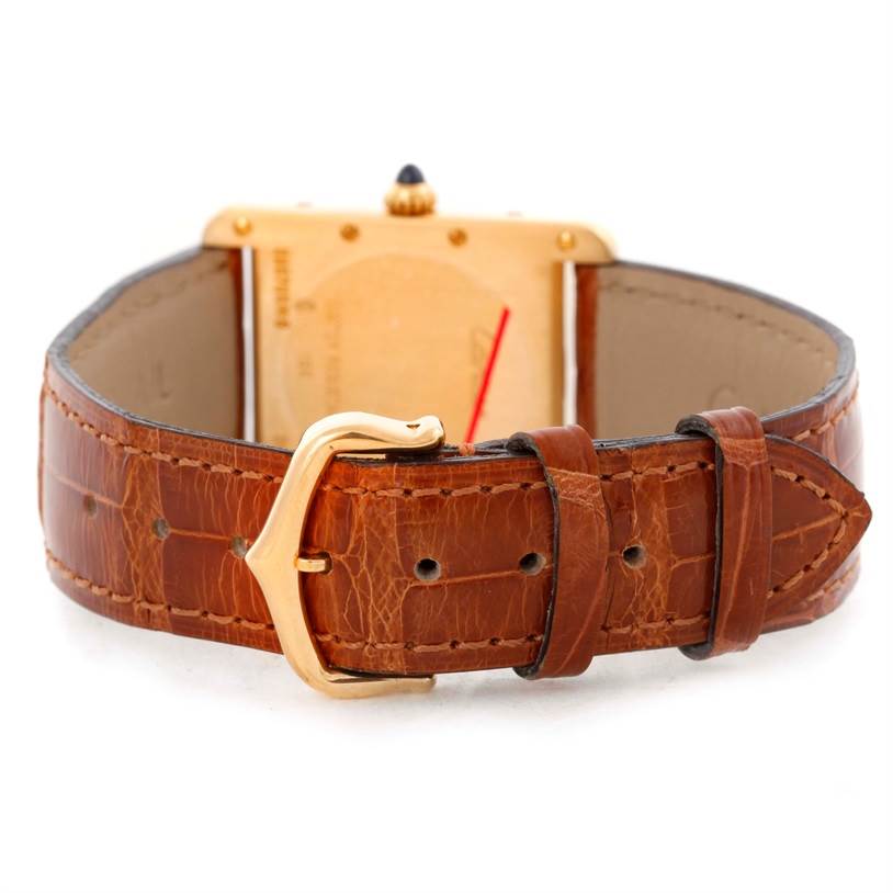 This image shows the back view of the Cartier Tank Louis W1529756 Men's Yellow Gold Silver Dial W1529756 Men's Yellow Gold Silver Dial watch, focusing on the leather strap and buckle.