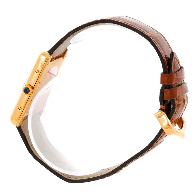 The image shows a Cartier Tank Louis W1529756 Men's Yellow Gold Silver Dial W1529756 Men's Yellow Gold Silver Dial watch from a side angle, highlighting its gold case, crown, and leather strap.