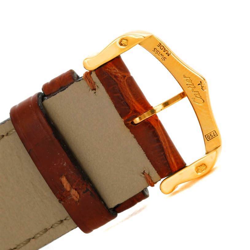 The image shows a close-up angle of the buckle and part of the leather strap of a Cartier Tank Louis W1529756 Men
s Silver Dial W1529756 Men
s Silver Dial model watch.