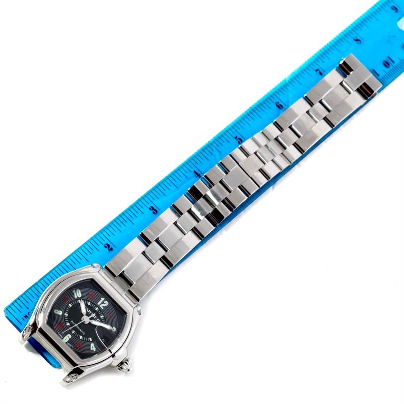 The Cartier Roadster W62002V3 Men's Stainless Steel Black Dial W62002V3 Men's Stainless Steel Black Dial watch is shown from an overhead angle, displaying the face and full bracelet alongside a ruler.