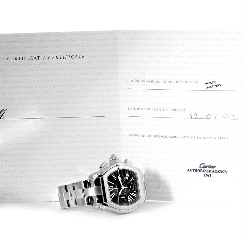 The Cartier Roadster W62020X6 Men
s Stainless Steel Black Dial W62020X6 Men
s Stainless Steel Black Dial watch is photographed from the front, showing the dial and part of the bracelet, placed on a certificate.