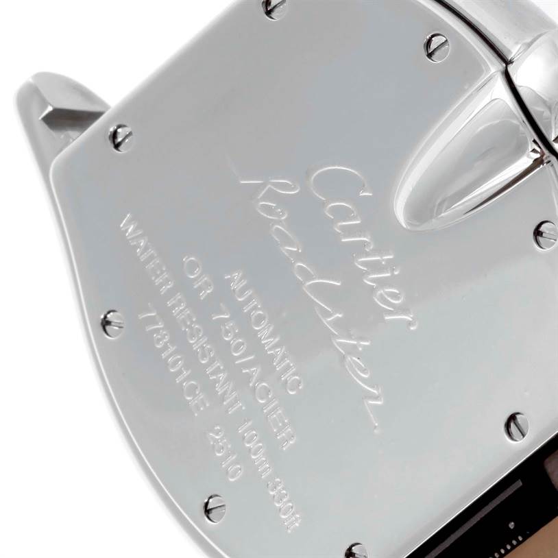 The image shows the back casing and partial side view of a Cartier Roadster W62031Y4 Men
s Steel and Gold (two tone) Silver Dial W62031Y4 Men
s Steel and Gold (two tone) Silver Dial watch.