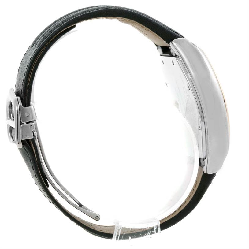 The image shows the side profile of a Cartier Roadster W62031Y4 Men
s Steel and Gold (two tone) Silver Dial W62031Y4 Men
s Steel and Gold (two tone) Silver Dial watch, highlighting its case and leather strap.