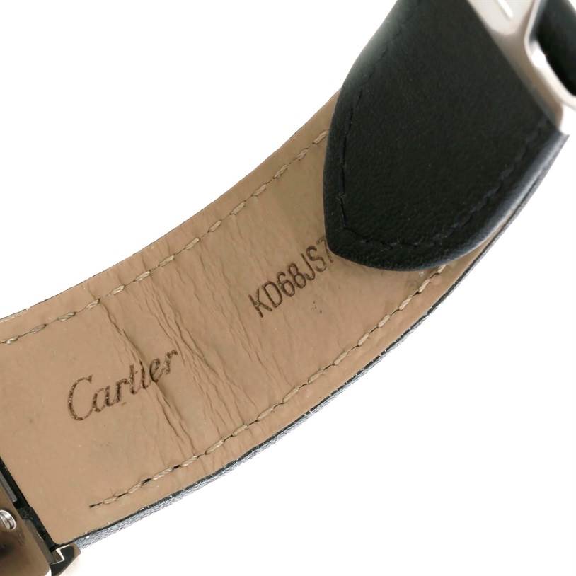 The image shows a close-up view of the underside of a leather strap for a Cartier Roadster W62031Y4 Men
s Steel and Gold (two tone) Silver Dial W62031Y4 Men
s Steel and Gold (two tone) Silver Dial watch, displaying the brand logo and serial number.