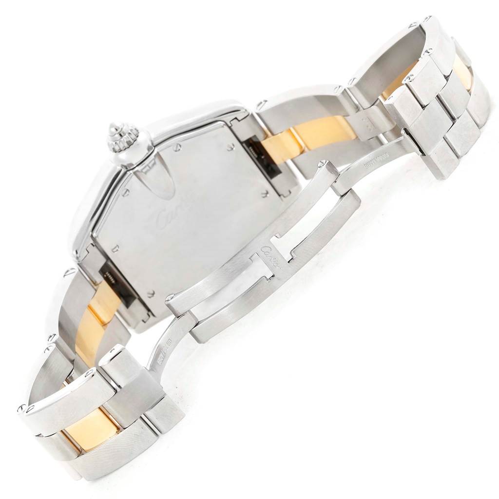 This image shows the back case and partly opened bracelet clasp of a Cartier Roadster W62031Y4 Men's Steel and Gold (two tone) Silver Dial W62031Y4 Men's Steel and Gold (two tone) Silver Dial model watch, focusing on the metal links.