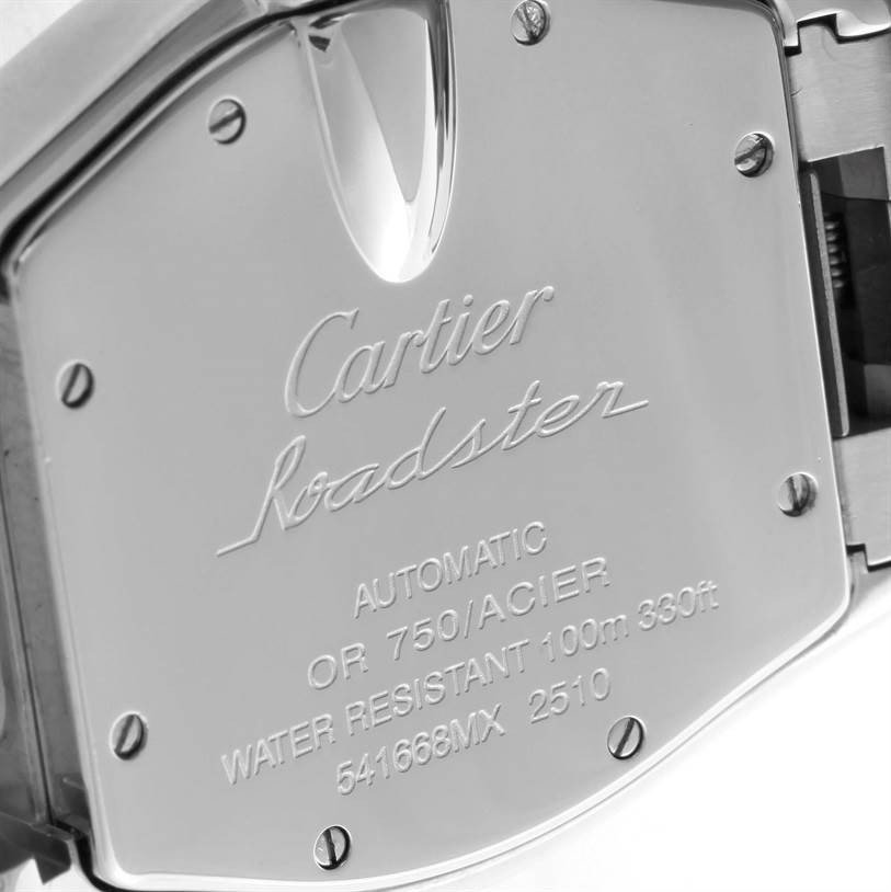 The image shows the back case of a Cartier Roadster W62031Y4 Men's Steel and Gold (two tone) Silver Dial W62031Y4 Men's Steel and Gold (two tone) Silver Dial watch, featuring engravings and screws.